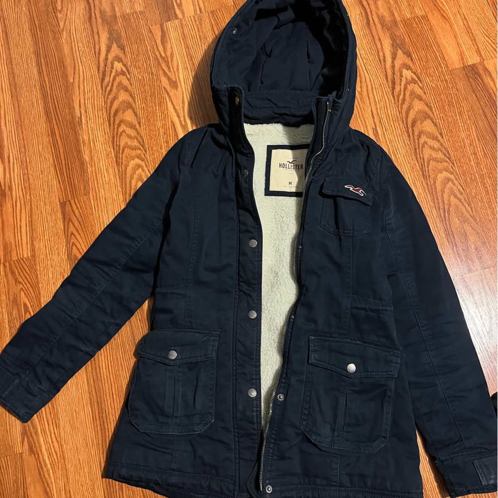 Medium size Hollister navy jacket.
